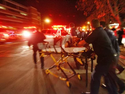 A male is moved from the Trolley Square Mall to an ambulance after a gunman opened fire in the mall hitting several people before he was killed by police Monday, Feb. 12, 2007, in Salt Lake City.(AP Photo/The Salt Lake Tribune, Danny Chan La) ** DESERET NEWS OUT **