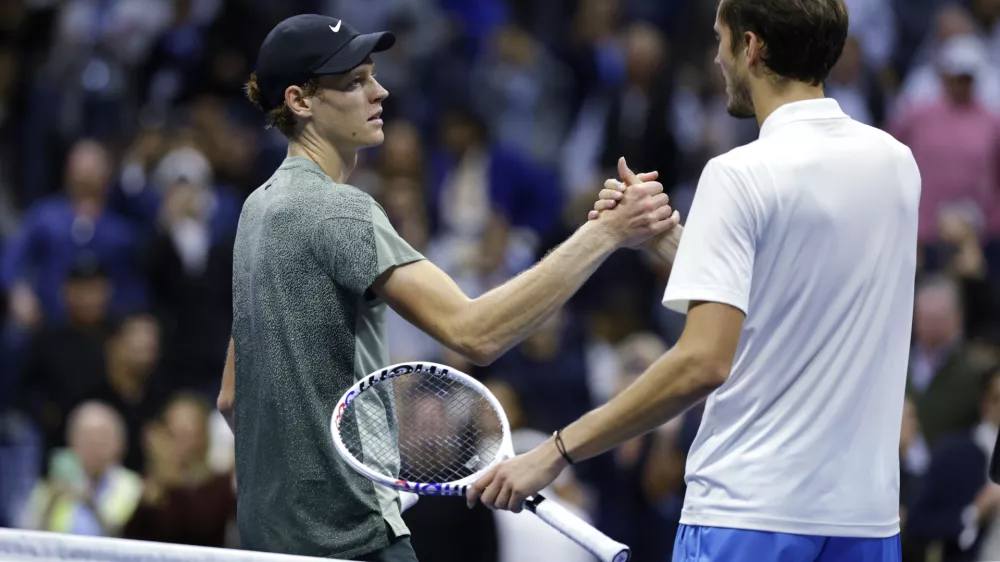 Jannik Sinner, of Italy, left, shakes hands after defeating Daniil Medvedev, of Russia, during the quarterfinals of the U.S. Open tennis championships, Wednesday, Sept. 4, 2024, in New York. (AP Photo/Adam Hunger)