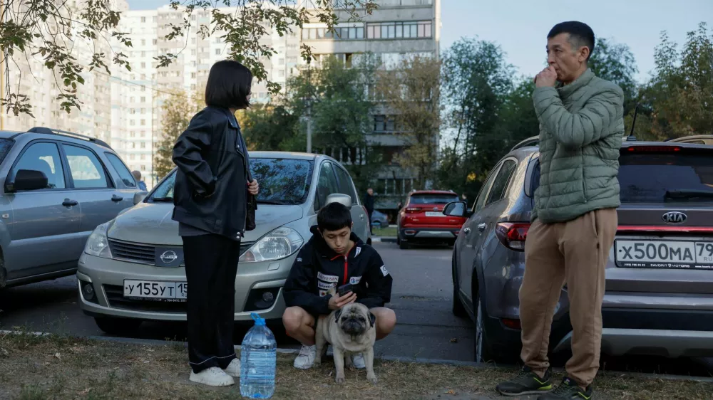 Local residents gather in the courtyard of a damaged multi-storey building following an alleged Ukrainian drone attack in the course of Russia-Ukraine conflict, in Ramenskoye in the Moscow region, Russia September 10, 2024. REUTERS/Maxim Shemetov