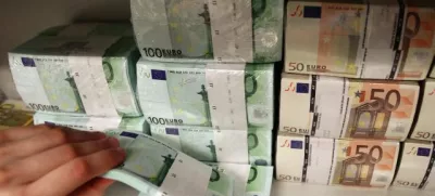 ﻿Euro bills are pictured in the safe of an Austrian bank in Vienna April 10, 2013. Austrian Finance Minister Maria Fekter will fight "like a lion" to defend the country's banking secrecy, she told a newspaper on Monday, promising to veto any steps that endanger the centuries-old tradition. Austria taxes interest income at source and sends the proceeds back to the depositor's home country without revealing any names, a system it defends as being more efficient than exchanging personal information with foreign governments. REUTERS/Heinz-Peter Bader (AUSTRIA - Tags: BUSINESS)