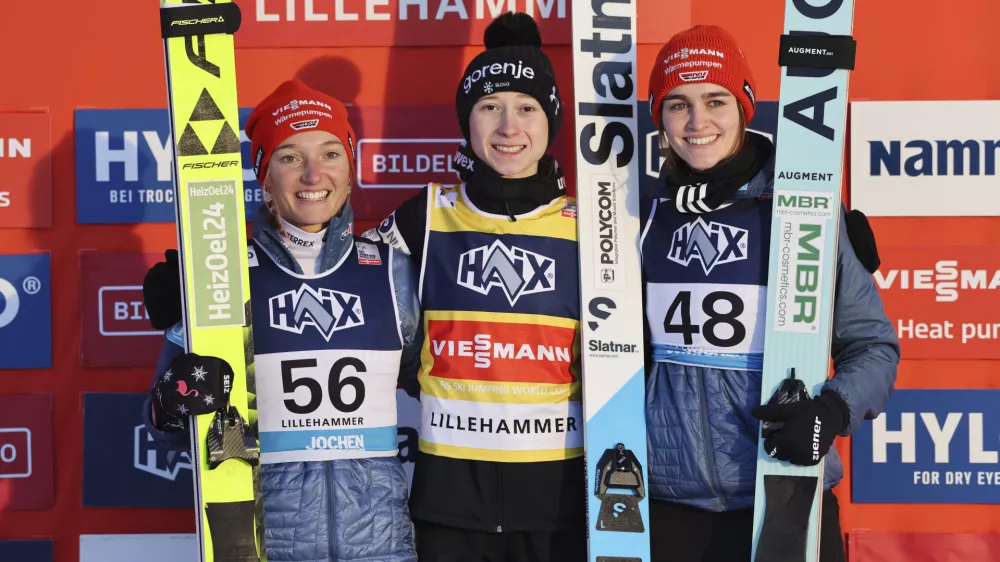 From left, Germany's Katharina Schmid, Slovenia's Nika Prevc and Germany's Selina Freitag pose on the podium after the Women's Individual HS140 competition at the ski jumping world cup in Lillehammer, Norway, Saturday, Nov. 23, 2024 (Geir Olsen/NTB Scanpix via AP)
