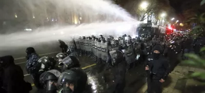 Police use a water cannon to prevent protesters pouring into the streets following Georgian Prime Minister Irakli Kobakhidze's announcement, rallying outside the parliament building in Tbilisi, Georgia, on Friday, Nov. 29, 2024. (AP Photo/Zurab Tsertsvadze)