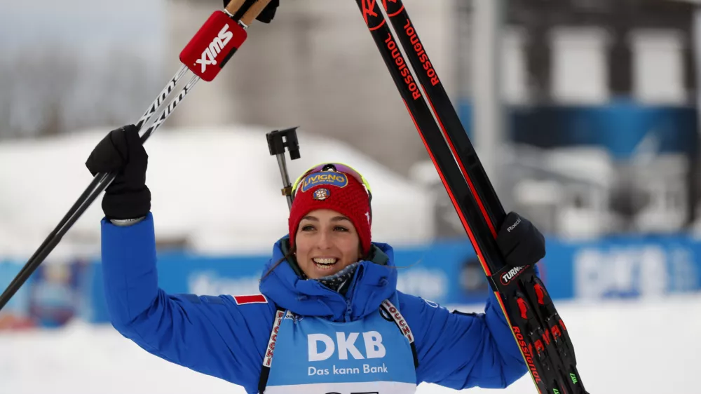 Italy's Lisa Vittozzi jubilates after taking first place in the women's Biathlon World Cup 7.5 km sprint event in Oberhof, Germany, Thursday, Jan. 10, 2019. (AP Photo/Petr David Josek)
