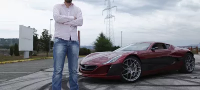﻿Mate Rimac owner of Rimac Automobili poses with the Concept One car in Zagreb August 31, 2012. Croatian concept car manufacturer Rimac Automobili based near Zagreb prepares to unveil a prototype of their Concept One electric supercar at the upcoming Salon Privé car show in London in early September.The Concept One has a carbon fiber body an electric motor powering each wheel, and can produce 1,088 horse powers, capable of achieving top speed of around 305 kmh (190 mph) with a range of 600 kilometres (373 miles), making it the world's fastest electric car. Costing around  million each, only 13 of these high-end electric cars are expected to be produced per year. Picture taken August 31, 2012. REUTERS/Antonio Bronic (CROATIA - Tags: TRANSPORT BUSINESS) - RTR37CTI