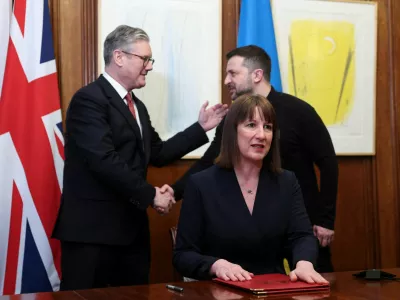 Britain's Chancellor of the Exchequer Rachel Reeves sit on the day she holds a video conference meeting with Ukraine's Finance Minister Sergii Marchenko, as British Prime Minister Keir Starmer and Ukrainian President Volodymyr Zelenskiy shake hands in London, Britain, March 1, 2025. REUTERS/Toby Melville/Pool