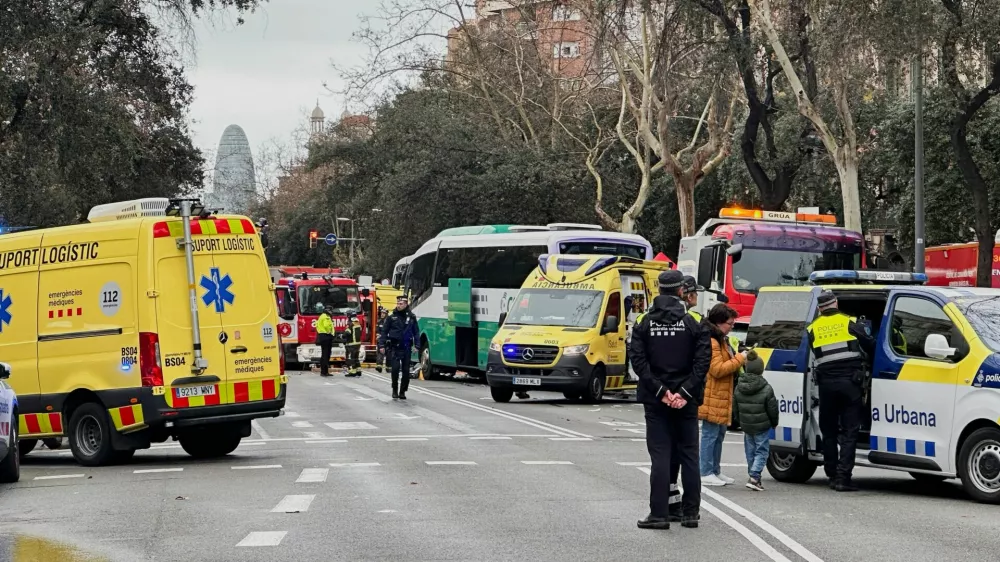 Emergency services work at the site of a collision between two buses carrying tourists, in which several people were injured, in central Barcelona, Spain, March 3, 2025. REUTERS/Horaci Garcia