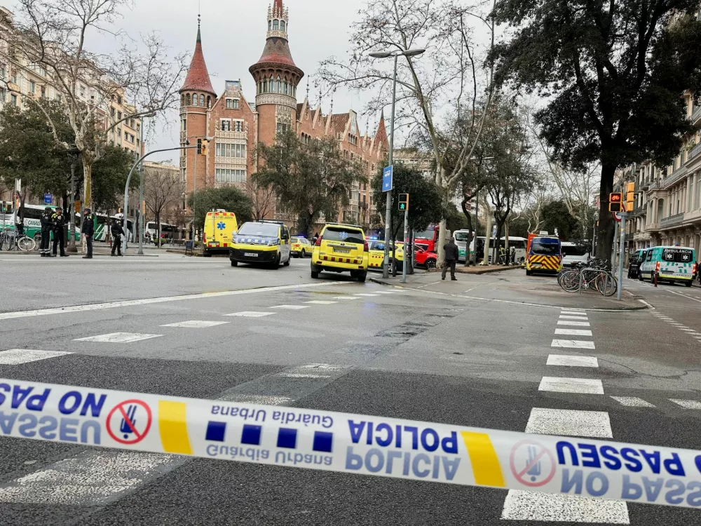 Emergency services work at the site of a collision between two buses carrying tourists, in which several people were injured, in central Barcelona, Spain, March 3, 2025. REUTERS/Horaci Garcia