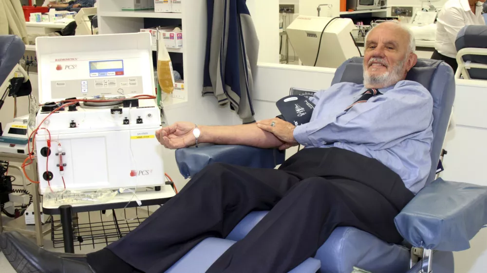 In this May, 2011, photo provided by Australian Red Cross Lifeblood donor James Harrison, credited with saving 2.4 million babies through his record-breaking blood plasma donations over decades, is giving blood at donation center in Sydney. (Australian Red Cross Lifeblood via AP)