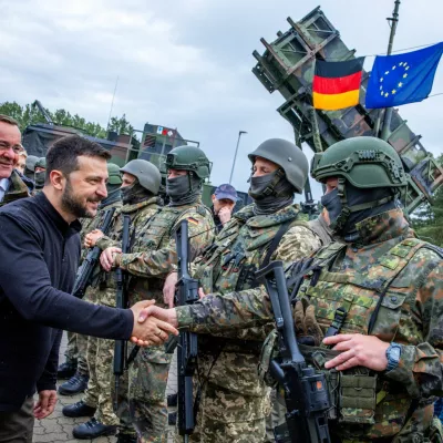 Ukrainian President Volodymyr Zelenskiy interacts with soldiers during his visit to a military training area to find out about the training of Ukrainian soldiers on the ?Patriot? anti-aircraft missile system, at an undisclosed location, in Germany, June 11, 2024.  Jens Buttner/Pool via REUTERS/File Photo