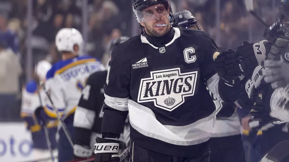 Mar 8, 2025; Los Angeles, California, USA; Los Angeles Kings center Anze Kopitar (11) celebrates with the bench after scoring against the St. Louis Blues during the first period at Crypto.com Arena. Mandatory Credit: Ryan Sun-Imagn Images