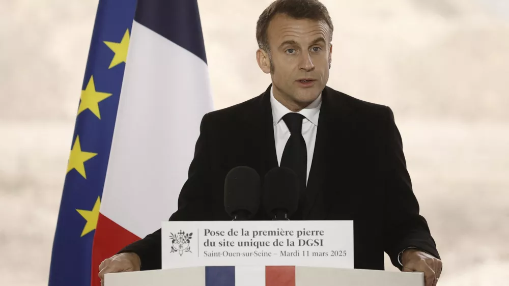 French President Emmanuel Macron delivers a speech as he visits the construction site of the future headquarters of France's domestic intelligence service DGSI, in Saint-Ouen, near Paris, France, 11 March 2025. YOAN VALAT/Pool via REUTERS