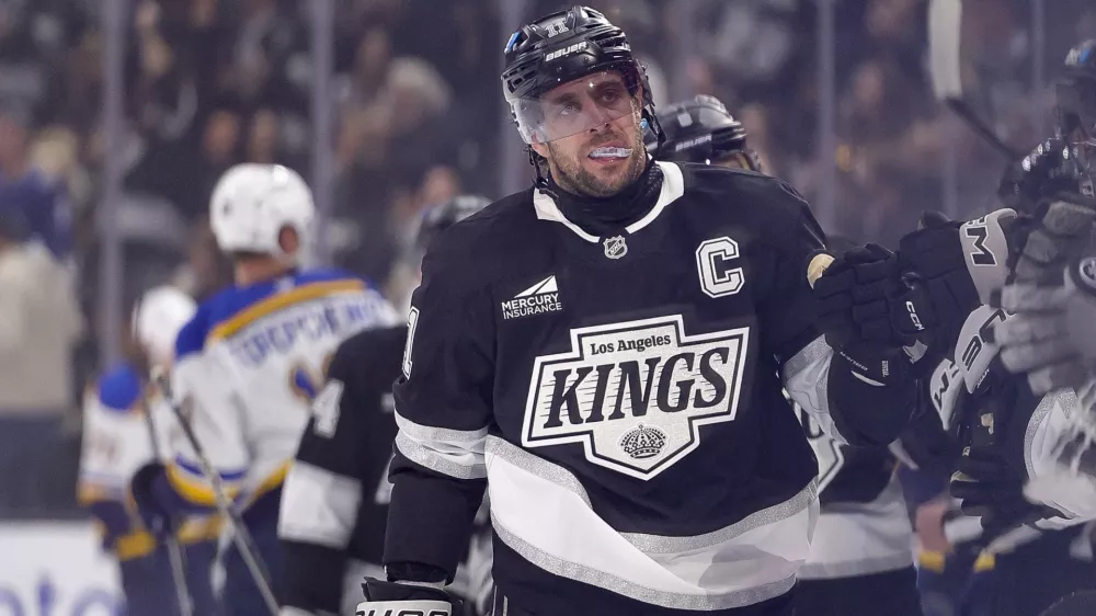 Mar 8, 2025; Los Angeles, California, USA; Los Angeles Kings center Anze Kopitar (11) celebrates with the bench after scoring against the St. Louis Blues during the first period at Crypto.com Arena. Mandatory Credit: Ryan Sun-Imagn Images