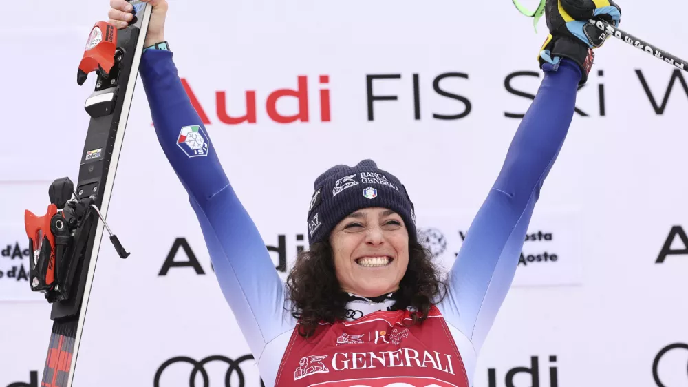 The winner Italy's Federica Brignone celebrates after an alpine ski, women's World Cup super G race, in La Thuile, Italy, Friday, March 14, 2025. (AP Photo/Marco Trovati)
