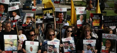Family members and supporters of hostages stand outside the Knesset, the Israeli parliament, during a statement to the press demanding the return of all hostages kidnapped during the deadly October 7, 2023 attack by Hamas, in Jerusalem, March 18, 2025. REUTERS/Ronen Zvulun