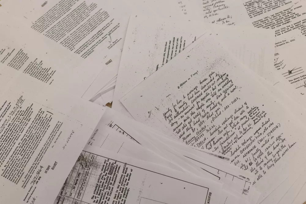 Documents related to the 1963 assassination of President John F. Kennedy are displayed after they were released following an order from U.S. President Donald Trump, in Washington D.C., March 18, 2025. REUTERS/Carlos Barria/Photo illustration