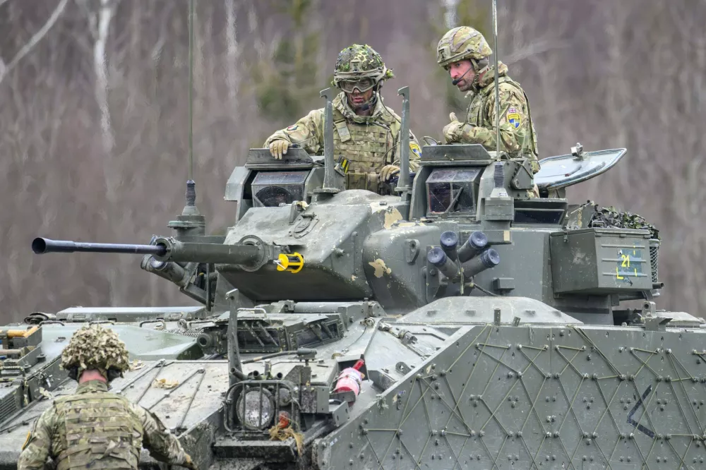 Prince William visits the training area at Tapa Camp to hear how the Mercians are using different weapon systems and learning new training and operating techniques. The Prince arrived in a Challenger 2. The two-day visit includes engagements with the Mercian Regiment, where His Royal Highness, in his role as Colonel-in-Chief, learns about their contribution to NATO's eastern flank under Operation Cabrit. The Prince will also explore Estonia's response to the ongoing conflict in Ukraine and its advancements in renewable energy and technology. Tapa, ESTONIA-21/03/2025 Prince William a Challenger Tank at Tapa Camp.The Prince of Wales visits the Mercian Regiment in his role as Colonel-in-Chief and learn about how they are bolstering NATO's eastern flank as part of Operation Cabrit.during his first official visit to Estonia. Tapa, ESTONIA-21/03/2025 //ROOKETIM_ESTONIA14293/Credit:Tim Rooke/SIPA/2503211344,Image: 977747975, License: Rights-managed, Restrictions:, Model Release: no