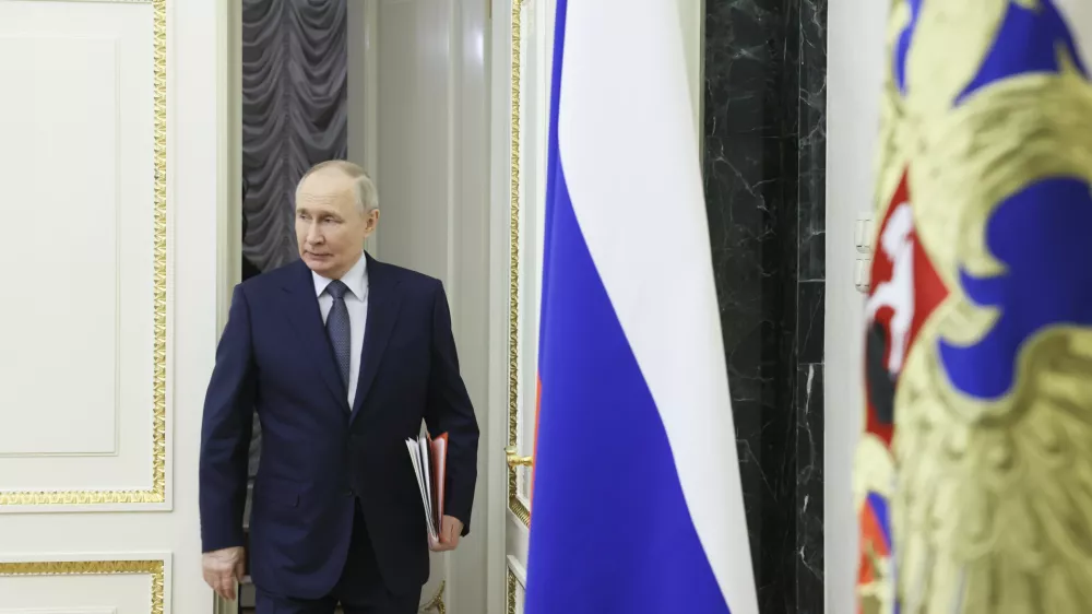 Russian President Vladimir Putin enters a hall for the Security Council meeting at the Kremlin in Moscow, Russia, Friday, March 21, 2025. (Aleksey Babushkin, Sputnik, Kremlin Pool Photo via AP)