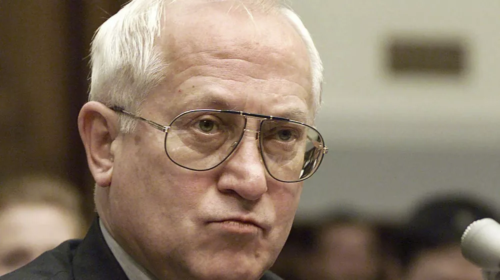 FILE - In this Oct. 26, 1999 file photo, Oleg Gordievsky, a former deputy head of the KGB in London, prepares to testify before a House Armed Services Subcommittee in Washington. He died March 4 in England at the age of 86. (AP Photo/Dennis Cook, File)