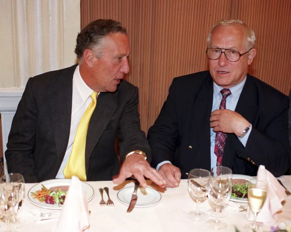 FILE - File photo dated 23/04/97 of author Frederick Forsyth, left. with Foyles luncheon chairman Oleg Gordievsky, at the Foyle's Literary,in London. Gordievsky died March 4 in England at the age of 86. (David Cheskin/PA via AP)