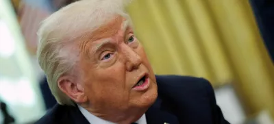 FILE PHOTO: U.S. President Donald Trump delivers remarks in the Oval Office at the White House, in Washington, D.C., U.S., March 21, 2025. REUTERS/Carlos Barria/File Photo