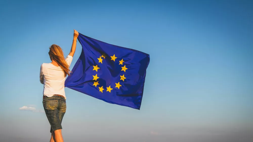 ﻿EU flag in female hands.
