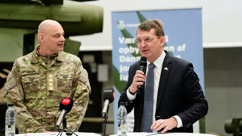 Denmark's Defense Minister Troels Lund Poulsen, right, and Chief of Defense Michael Hyldgaard attend a press conference on a ground-based air defense system, in Gadstrup, Denmark Wednesday, March 26, 2025. (Mads Claus Rasmussen/Ritzau Scanpix via AP)