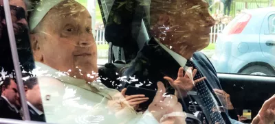 Pope Francis leaves on a car after appearing at a window of the Agostino Gemelli Polyclinic in Rome, Sunday, March 23, 2025, where he has been treated for bronchitis and bilateral pneumonia since Feb. 14. (AP Photo/Stefano Costantino)