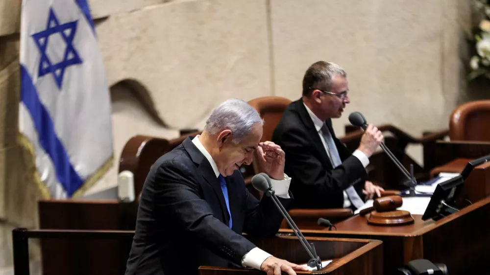 ﻿Israeli Prime Minister Benjamin speaks during a special session of the Knesset, Israel's parliament, to approve and swear-in a new coalition government, in Jerusalem June 13, 2021. REUTERS/Ronen Zvulun