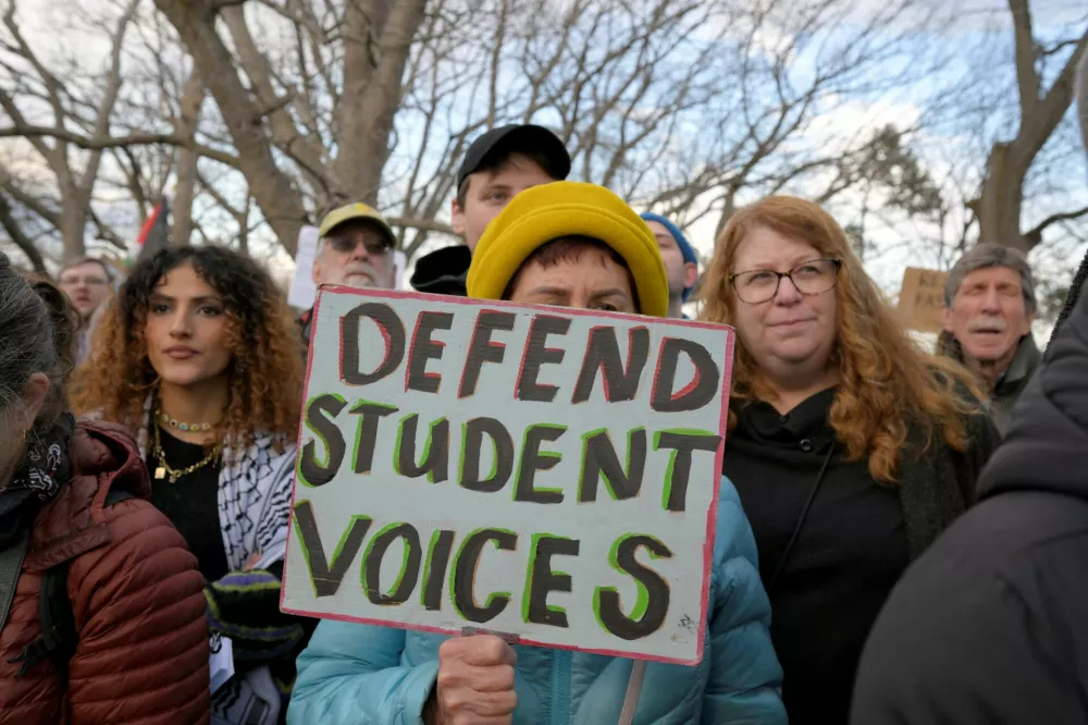 Demonstrators take part in the Stand with Rumeysa Ozturk,Tufts PHD Student emergency rally, at Powder House Square Park, after Ozturk was taken into custody by federal agents, in Somerville, Massachusetts, U.S. March 26, 2025. REUTERS/Faith Ninivaggi