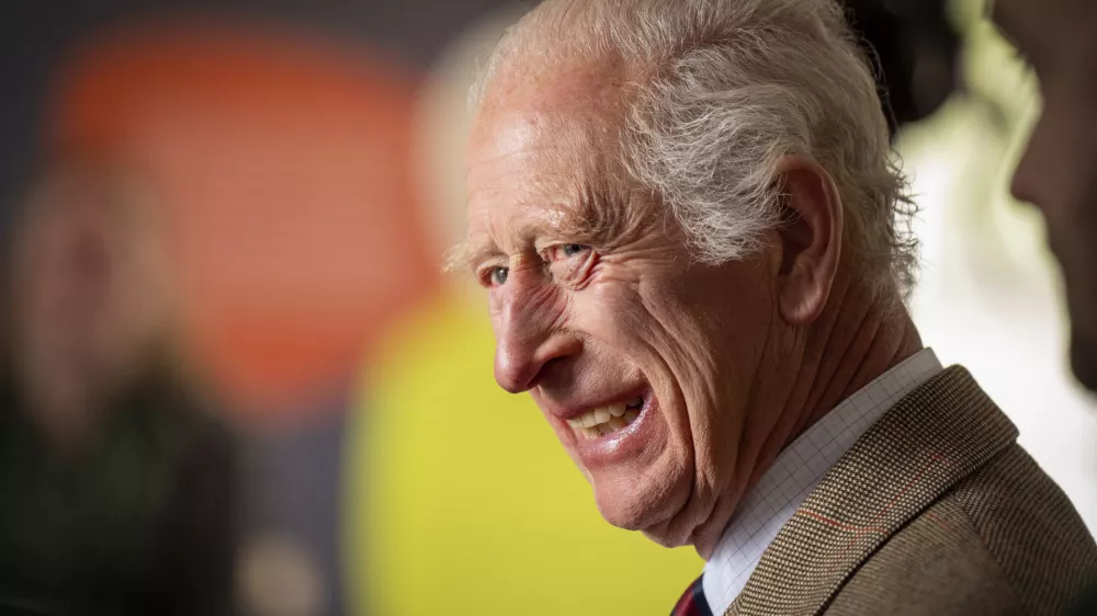 FILE - Britain's King Charles III smiles during his visit to the Forsinard Flows Visitor Centre in Forsinard, Highland, Scotland, July 31, 2024. (Jane Barlow/Pool Photo via AP, File)
