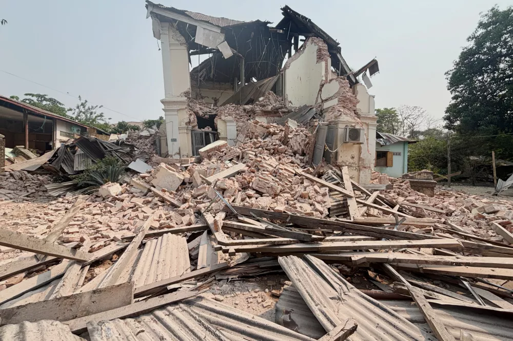 A building is damaged after earthquake Friday, March 28, 2025, in Naypyitaw, Myanmar. (AP Photo/Aung Shine Oo)
