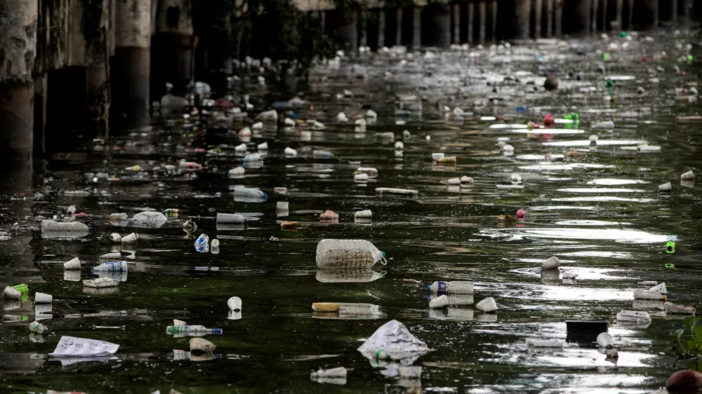 FILE PHOTO: Plastic bottles float on the heavily polluted San Juan River, a tributary of Pasig River in Mandaluyong City, Philippines, June 21, 2021. REUTERS/Eloisa Lopez