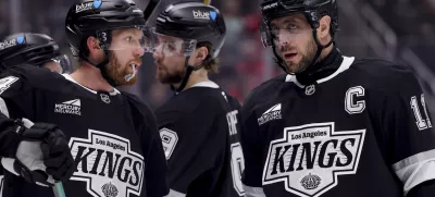 Mar 13, 2025; Los Angeles, California, USA; Los Angeles Kings center Anze Kopitar (11) speaks with defenseman Vladislav Gavrikov (84) during the first period of a game against the Washington Capitals at Crypto.com Arena. Mandatory Credit: Ryan Sun-Imagn Images