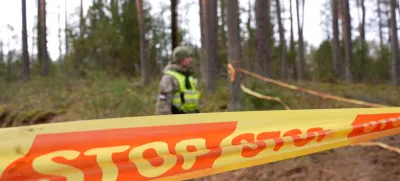 A soldier stands next to cordon tape at the scene of a rescue operation at Pabrade training ground, in Lithuania, March 31, 2025. Lithuanian Armed Forces/Handout via REUTERS ATTENTION EDITORS - THIS IMAGE HAS BEEN SUPPLIED BY A THIRD PARTY. NO RESALES. NO ARCHIVES. MANDATORY CREDIT