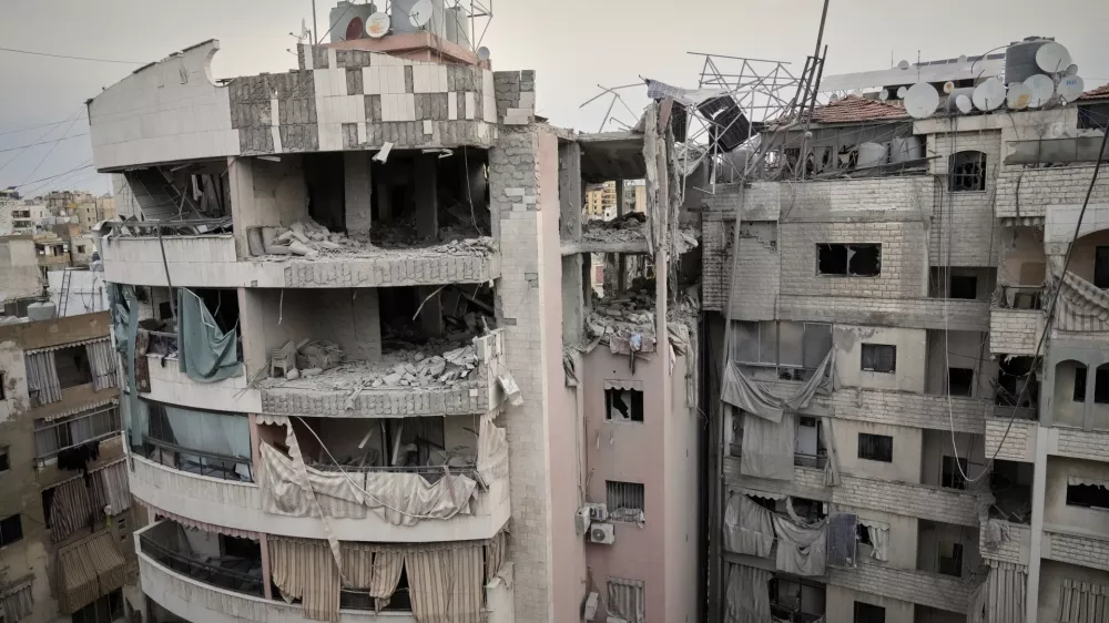 A damaged apartment building is seen after being struck earlier by an Israeli targeted attack in Dahiyeh, a southern suburb of Beirut, Lebanon, early Tuesday, April 1, 2025. (AP Photo/Hussein Malla)