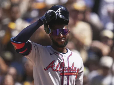 FILE - Atlanta Braves' Jurickson Profar acknowledges the crowd as he walks up to bat during the first inning of an opening-day baseball game against his former team, the San Diego Padres, March 27, 2025, in San Diego. (AP Photo/Gregory Bull, File)