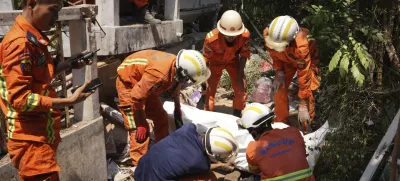 Myanmar's rescuers recover a body from a collapsed building following Friday's earthquake in Naypyitaw, Myanmar, Tuesday, April 1, 2025. (AP Photo)