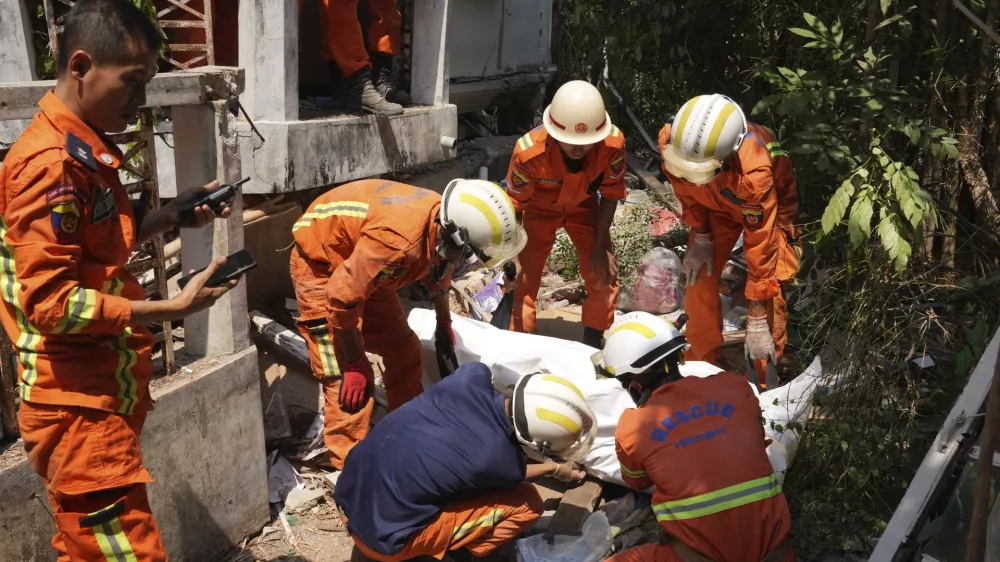 Myanmar's rescuers recover a body from a collapsed building following Friday's earthquake in Naypyitaw, Myanmar, Tuesday, April 1, 2025. (AP Photo)