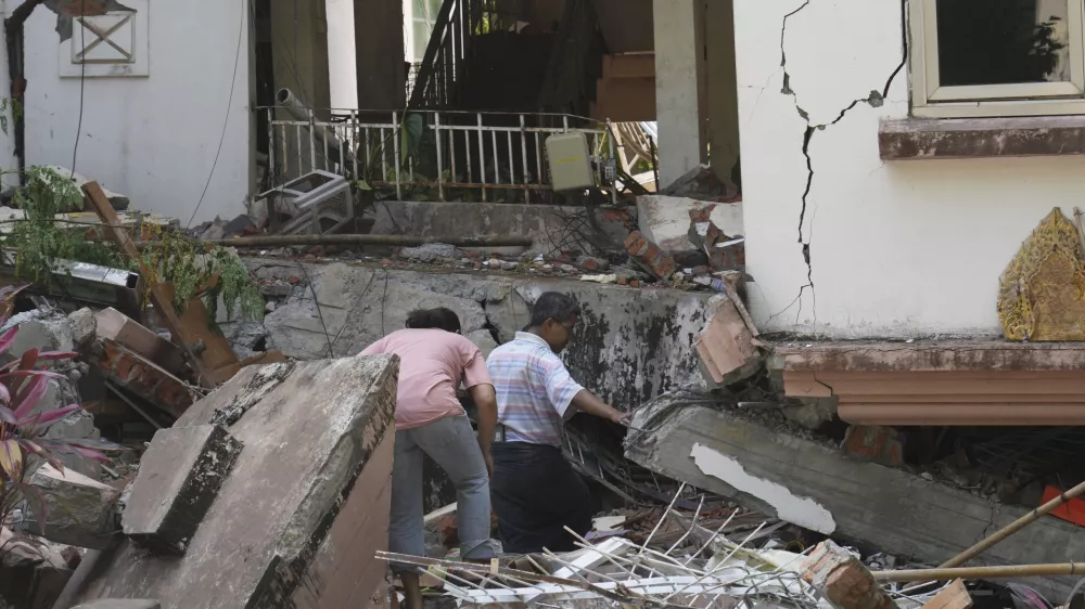 People inspect their homes, damaged following Friday's earthquake in Naypyitaw, Myanmar, Wednesday, April 2, 2025. (AP Photo)