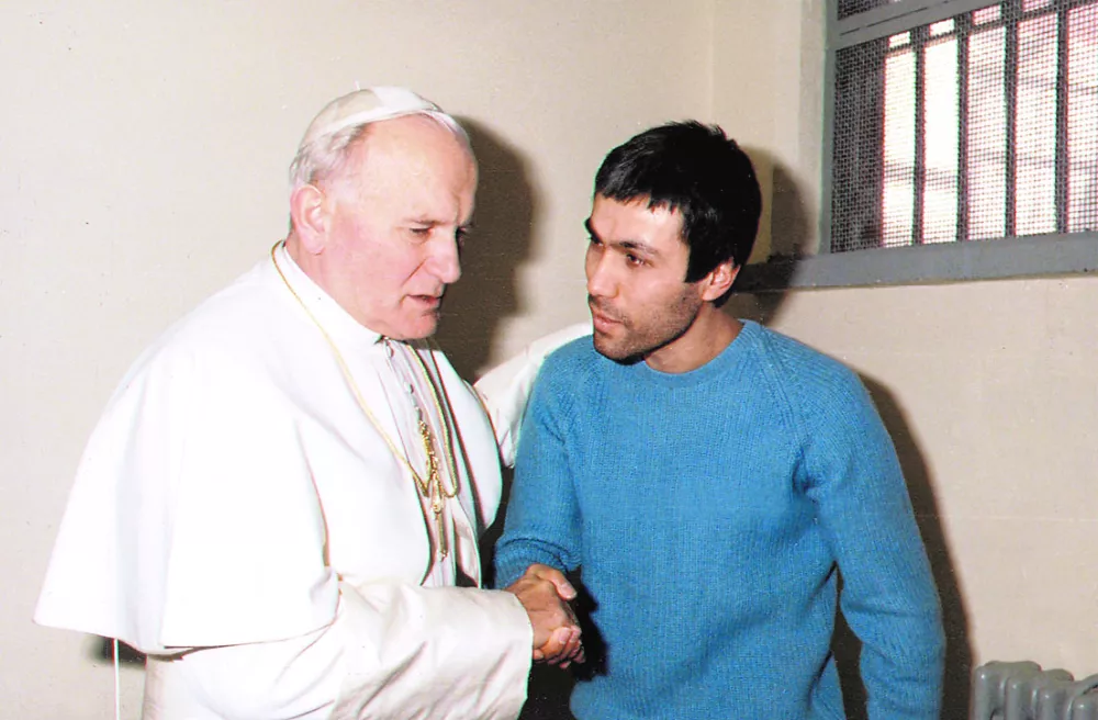 The then Pope John Paul meets with his would-be assassin, Turkish gunman Mehmet Ali Agca, in a cell of Rome's Rebibbia prison in this December 27, 1983 file photo. Agca, the man who shot and seriously wounded the Pope in 1981, will be freed from prison this month, the Anatolian state news agency said onJanuary 8, 2006. REUTERS/Vatican/Files------3k - psa