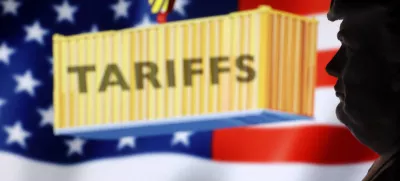 A 3D-printed miniature model of U.S. President Donald Trump, U.S. Flag and word "Tariffs" are seen in this illustration taken, April 2, 2025. REUTERS/Dado Ruvic/Illustration