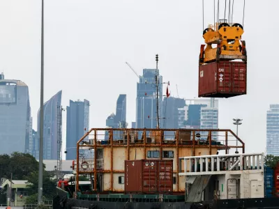 A container is loaded onto a cargo ship while docked at the port of Bangkok, in Bangkok, Thailand, April 3, 2025. Thailand, with a tariff rate of 37 per cent imposed by U.S. President Donald Trump, is one of the six countries in the Southeast Asian region slapped with much higher-than-expected traffis by the U.S. REUTERS/Athit Perawongmetha