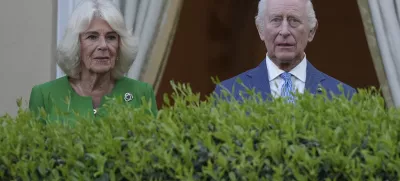 King Charles III, right, and Queen Camilla listen to the band of the Welsh Guards as they arrive at the Residence of the British Ambassador to Italy Villa Wolkonsky in Rome, Tuesday, April 8, 2025 to meet with memebers of the British community in Italy. (AP Photo/Andrew Medichini)