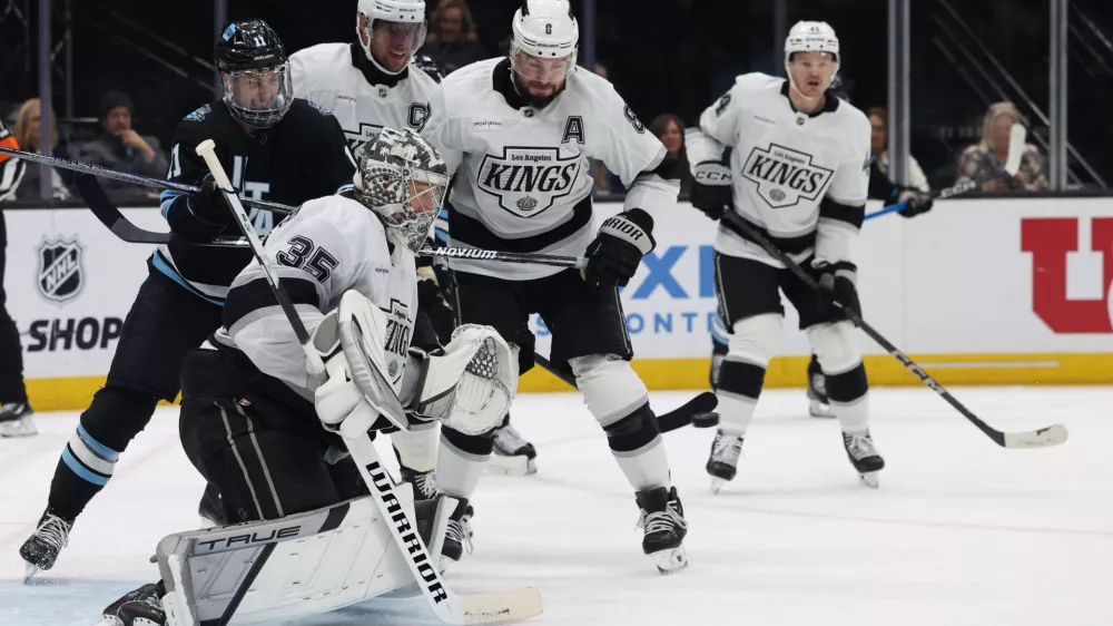 Apr 3, 2025; Salt Lake City, Utah, USA; Los Angeles Kings goaltender Darcy Kuemper (35) makes a save against the Utah Hockey Club during the second period at Delta Center. Mandatory Credit: Rob Gray-Imagn Images