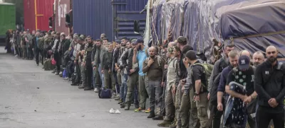 Captured Romanian mercenaries, who were fighting alongside Democratic Republic of Congo army (FRDC), wait to be released by M23 rebels at Gisenyi border point in Congo, Wednesday, Jan. 29, 2025, after the M23 rebels advanced into eastern Congo's capital Goma. (AP Photo/Brian Inganga)