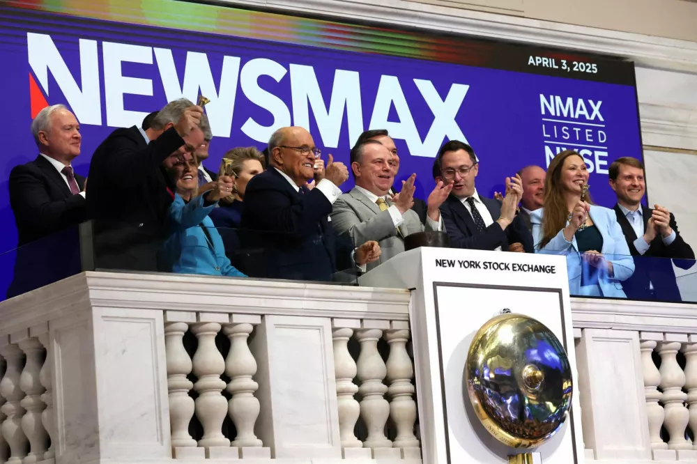 Christopher Ruddy, CEO of Newsmax Inc., and other guests ring the opening bell celebrating the company's IPO, which happened earlier in the week, at the New York Stock Exchange (NYSE) in New York City, U.S., April 3, 2025. REUTERS/Brendan McDermid