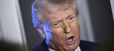 President Donald Trump speaks to reporters while in flight on board Air Force One, en route to Miami, Thursday, April 3, 2025. (Pool via AP)