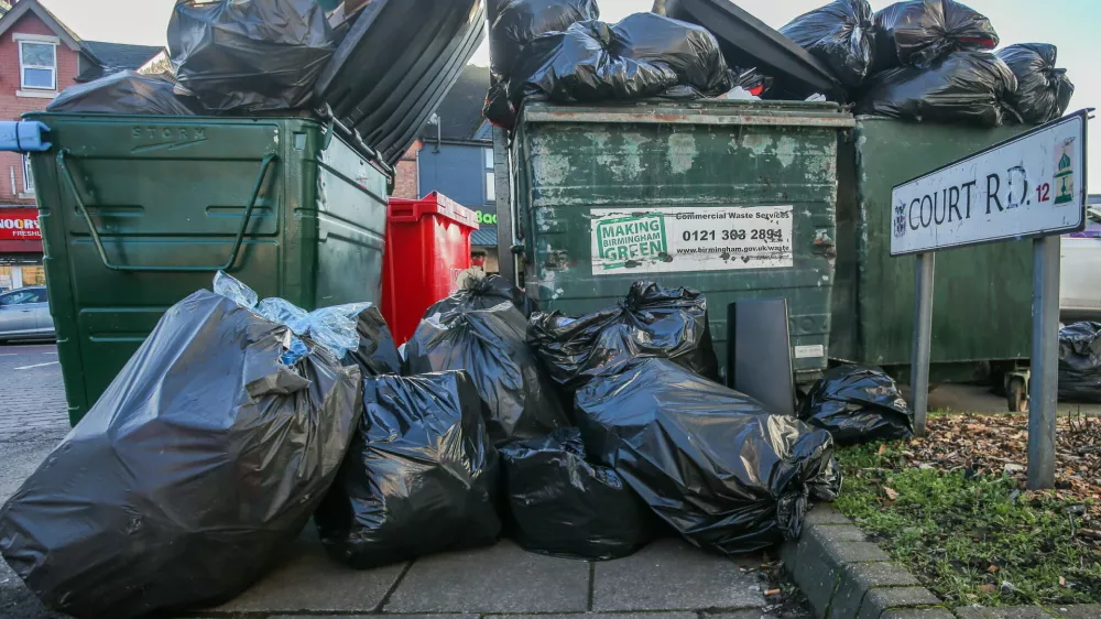 Rubbish on the street in Court Road, Balsall Heath, Birmingham, as bin workers strike for 12 days in February, February 6 2025. Release date February 10 2025. Shocking photos show mountains of fly-tipped rubbish and overflowing bins along Birmingham's streets after bin workers went on strike. Residents say the bankrupt city is now being invaded by giant rats after industrial action left neighbourhoods littered with festering mounds of waste. Families also say they fear for the health of their children after some residential areas were turned into a "makeshift dump" which "stinks". Refuse collectors have walked out on seven dates so far and have scheduled in at least 24 other days in response to fears of wide-scale pay cuts. And the impact of the strikes can already be seen in the Balsall Heath and Small Heath areas of the second city. Locals there say recycling collection is often ignored and businesses in the area haven't had a waste collection in three weeks.