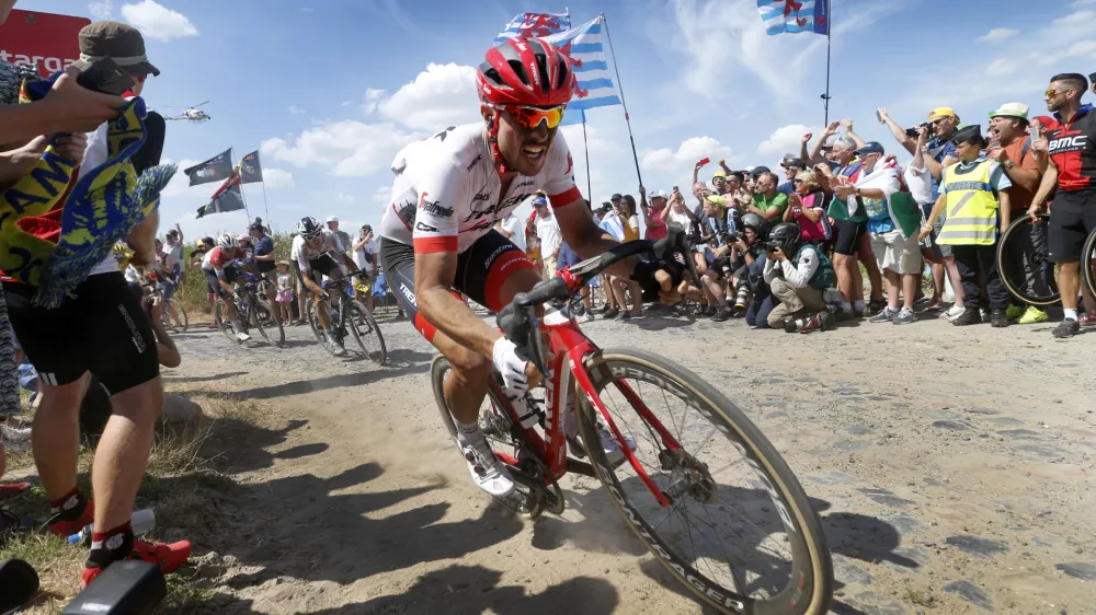 ﻿dpatop - German John Degenkolb of Trek-Segafredo traverses cobblestones during stage nine of the 105th edition of the Tour de France cycling race, from Arras Citadelle to Roubaix, in France, 15 July 2018. Photo: Yuzuru Sunada/BELGA/dpa