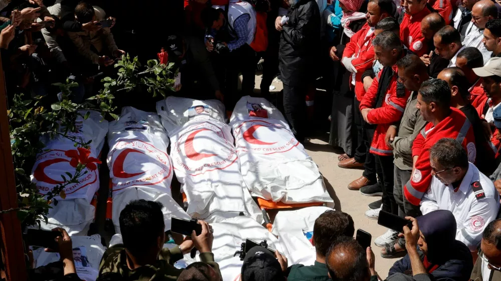 FILE PHOTO: Palestinians mourn medics, who came under Israeli fire while on a rescue mission, after their bodies were recovered, according to the Red Crescent, at Nasser hospital in Khan Younis in the southern Gaza Strip March 31, 2025. REUTERS/Hatem Khaled/File Photo